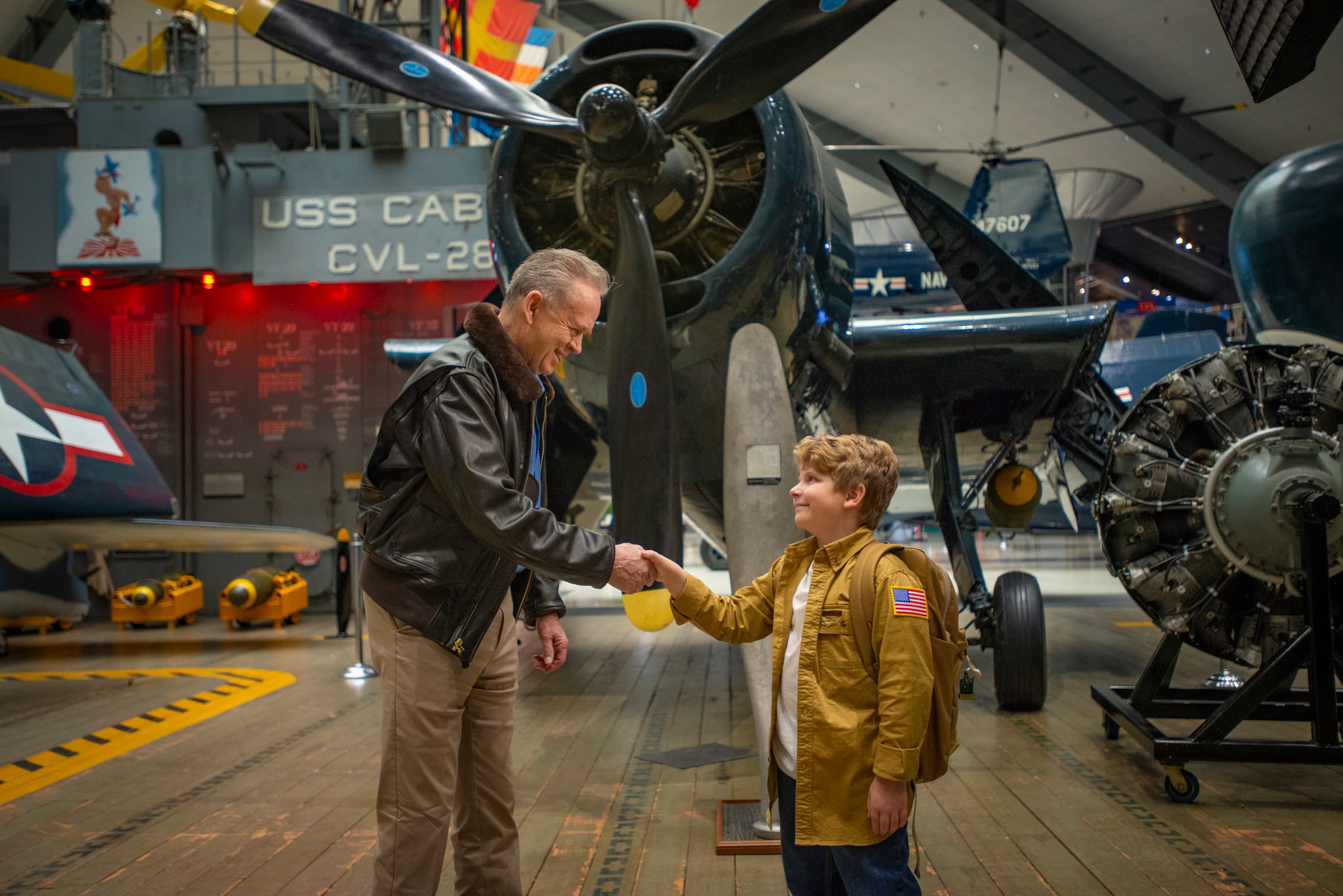 Visitors connect among historic naval aircraft at the National Naval Aviation Museum